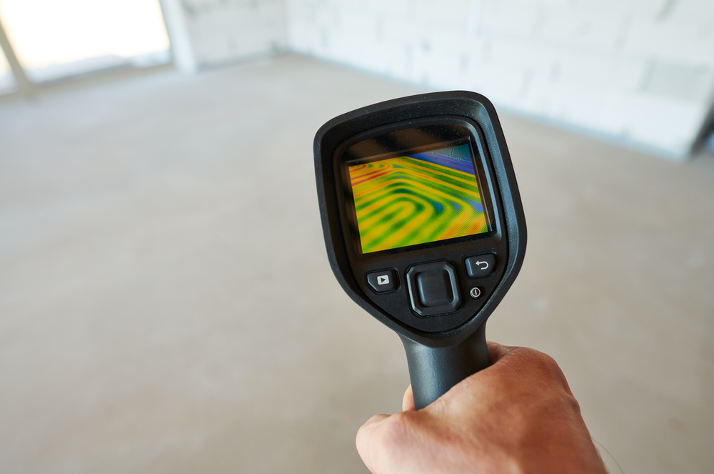Thermal imaging camera inspection for temperature check and finding heating pipes in floor