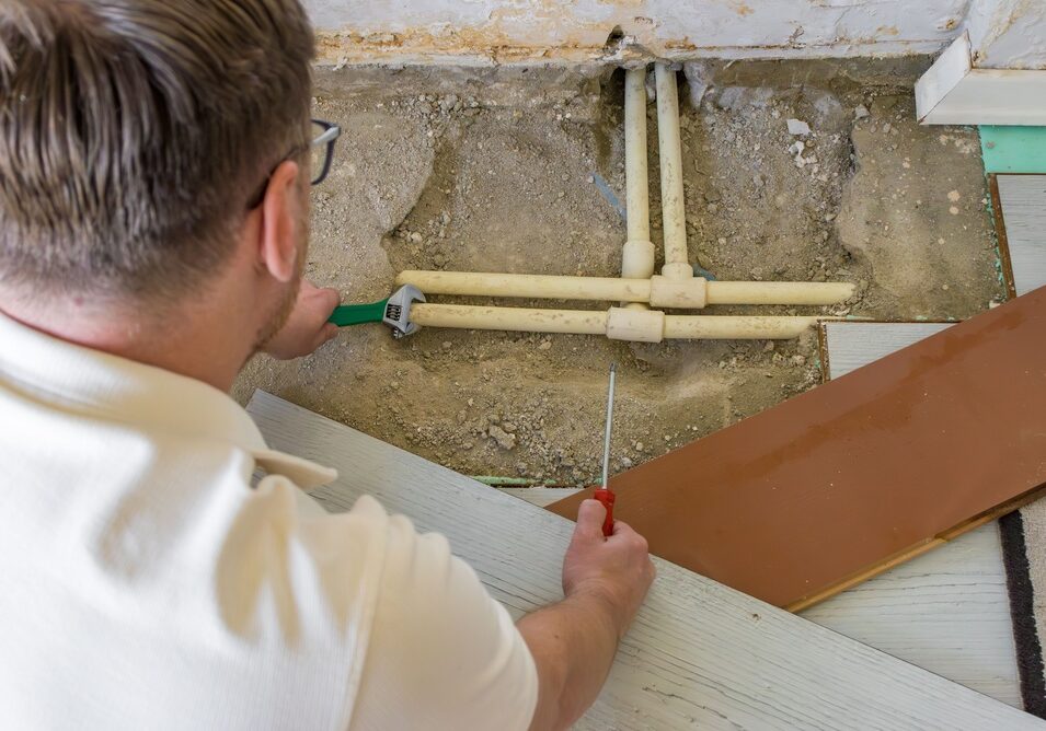 Handyman,Repairing,Household,Water,Pipes,Under,Removed,Laminate,Flooring.,Plumbing