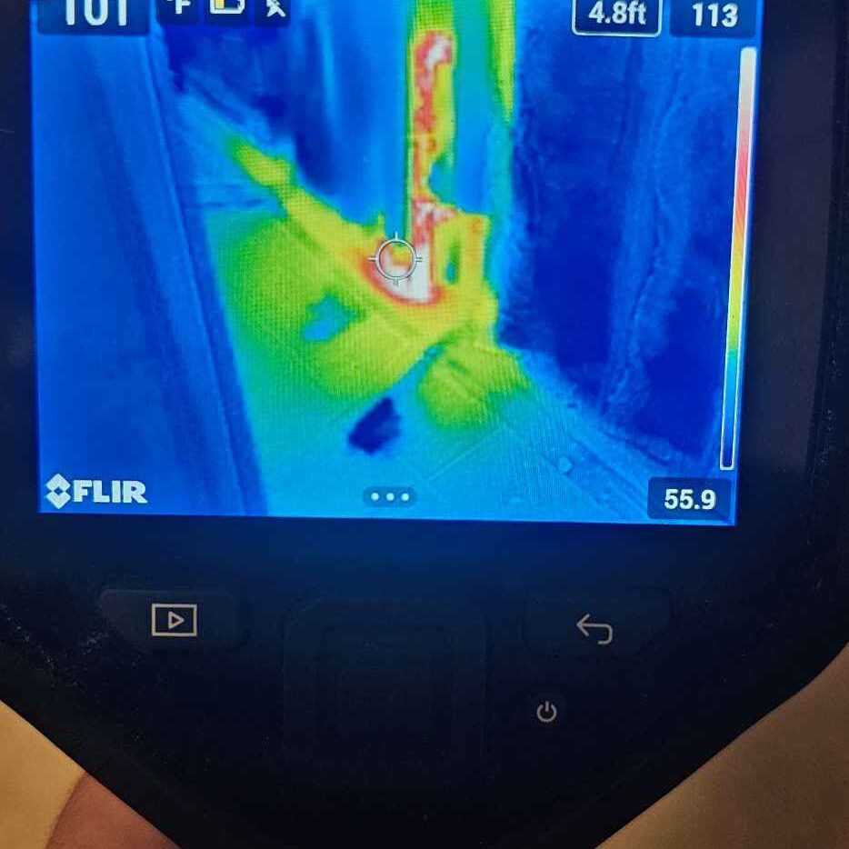 hand holding thermal imaging camera