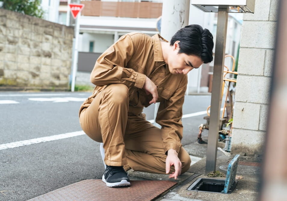 person looking at a water meter