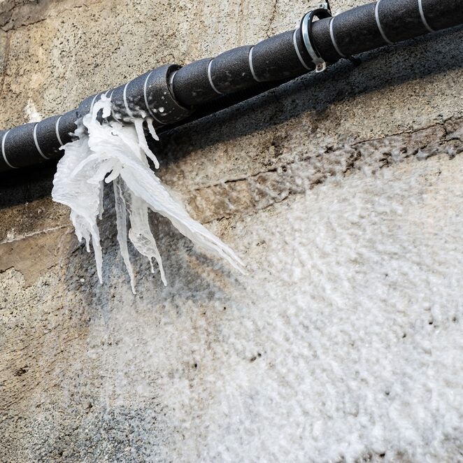 Frozen,Water,After,Burst,From,A,Pipe,At,The,Winter.