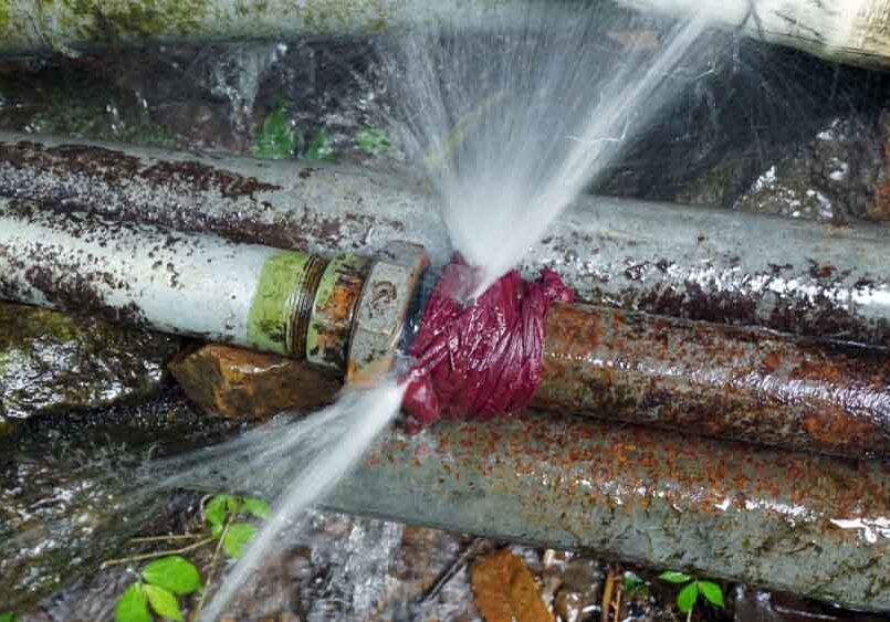 water coming from a burst pipe line